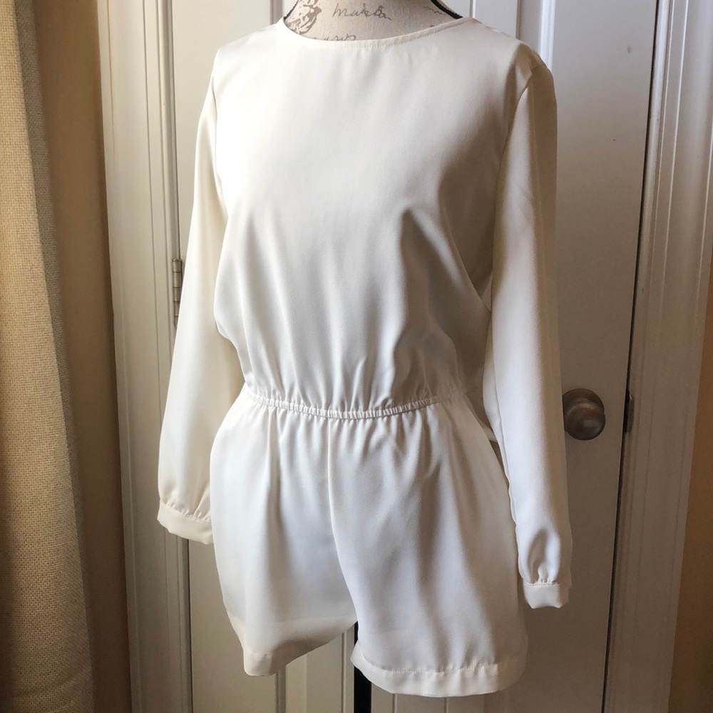 White/off white romper with pockets.
